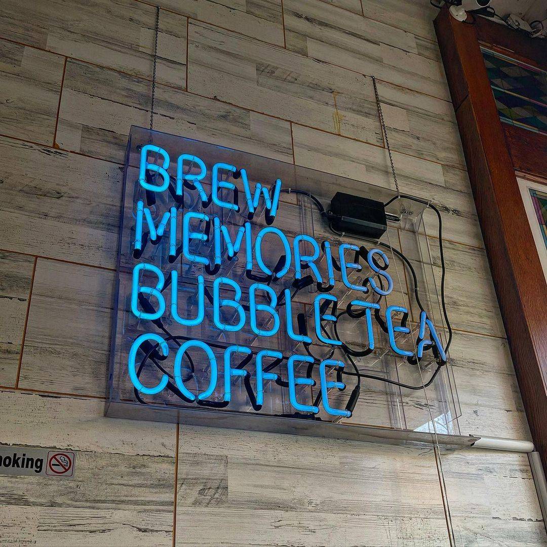 Interior of Brew Memories, a trendy coffee and bubble tea shop in Park Slope, Brooklyn, featuring a cozy ambiance and diverse beverage menu.